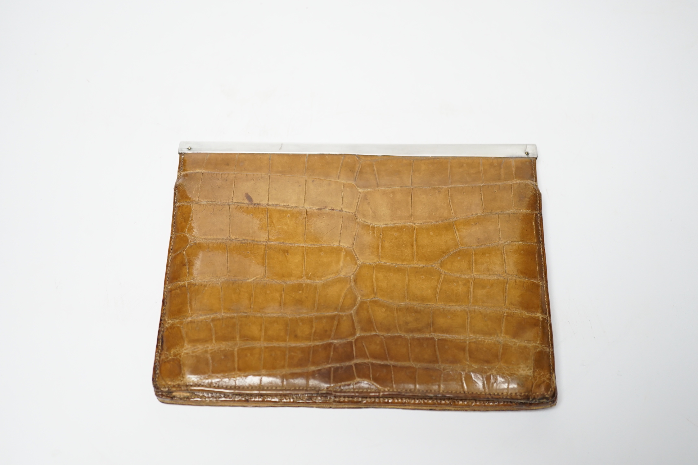An Edwardian lady’s silver mounted crocodile clutch bag